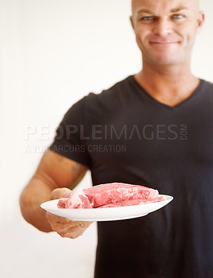 Buy stock photo Food, diet and man with raw meat for a body builder, protein and carnivore eating plan to bulk. Cooking, health and portrait of a male person with beef or steak to cook healthy dinner, lunch or meal.