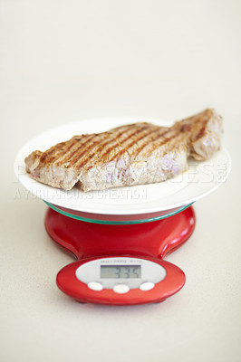 Buy stock photo Weighing dinner, scale and measuring beef for calories, nutritional value and protein on a plate. Healthy meat, measurement and a steak for dietary portion for a balanced diet on a table for lunch