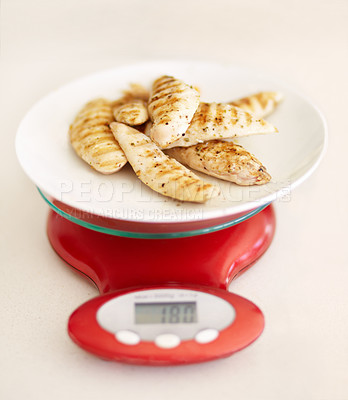 Buy stock photo Protein, diet and chicken breast on a scale in studio from above on a table in the kitchen for health or wellness. Food, meat and nutrition with healthy organic lunch on a plate to measure the weight