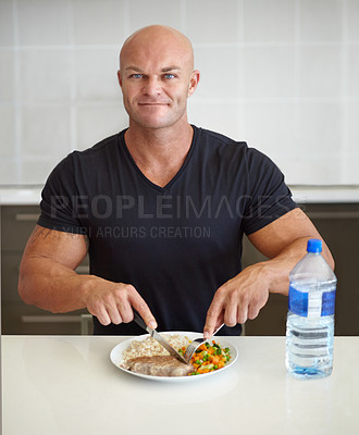 Buy stock photo Bodybuilder man, meal and home in portrait with food, water and healthy protein for wellness, diet or smile. Guy, body builder and eating with dining, nutrition or health at dinner for lifestyle