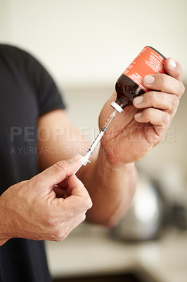 Buy stock photo Man, filling a syringe or liquid injection of testosterone and bottle, steroids and closeup of bodybuilder hands. Athlete, fitness performance on hormone supplement and medicine vial with needle 