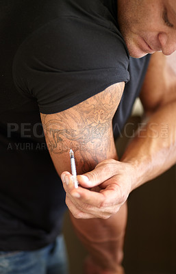 Buy stock photo Fitness, steroids and man with injection for arm, muscle development and needle with banned drugs. Male person, bodybuilder and guy with tattoo, bicep growth and syringe with illegal supplements