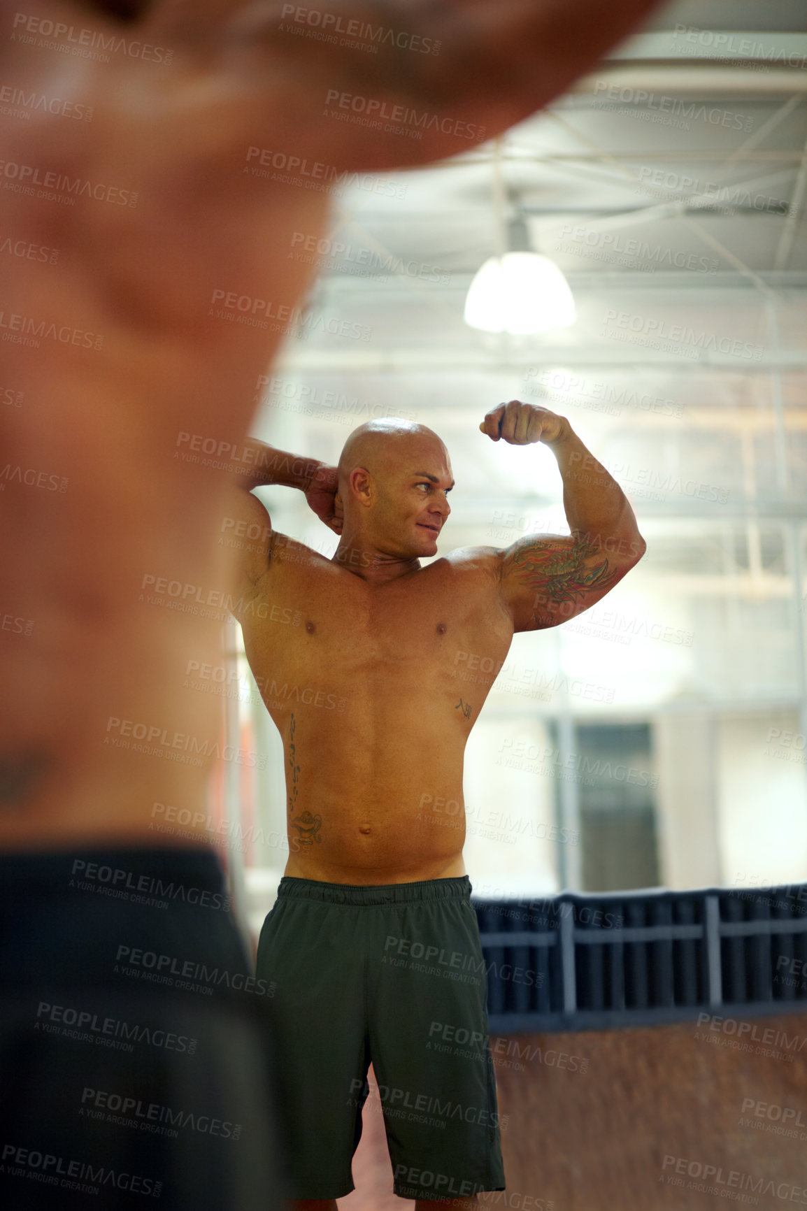 Buy stock photo Strong man, arm flexing and mirror at gym with fitness, workout and exercise of bodybuilder with reflection. Muscle, male person and athlete with training, wellness and body builder at a health club