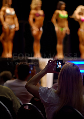 Buy stock photo Audience, woman and fitness of bodybuilder or beauty pageant for photography, judge or competition. Female person for photograph, picture or capture of professional models in bikini or lingerie