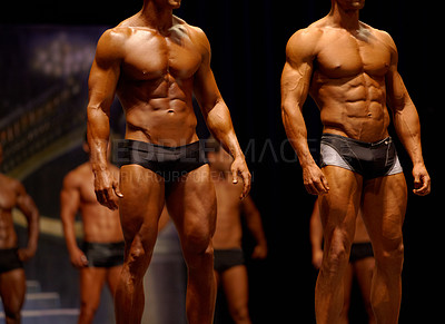 Buy stock photo Man, fitness and line of professional bodybuilder on stage for  sports, judge or competition. Male person or muscular group of models standing in confidence, underwear or lingerie for contest