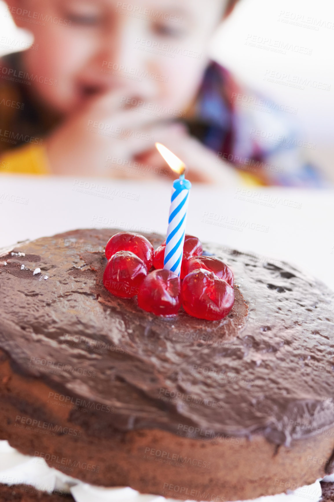 Buy stock photo Birthday cake closeup, young kid and celebration candle with dessert at home with a child. Chocolate, cherry and candles to celebrate a boy at a party with sweets on a kitchen table in a house