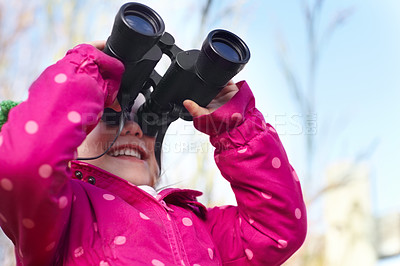 Buy stock photo Binoculars, nature and child for explore, discovery and looking on adventure outdoors. Travel, winter and happy, young and excited girl search on holiday, vacation and freedom on weekend for camping