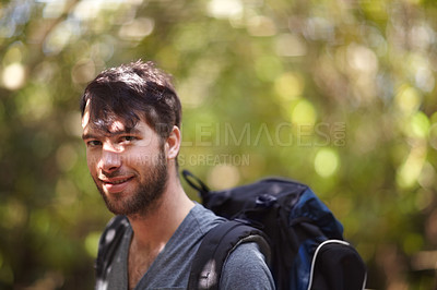 Buy stock photo Portrait, man and smile for hike in forest for fitness, wellness or travel in Sweden. Face, person and backpack with supplies for trip, camping or adventure in nature, fresh air and plants in woods