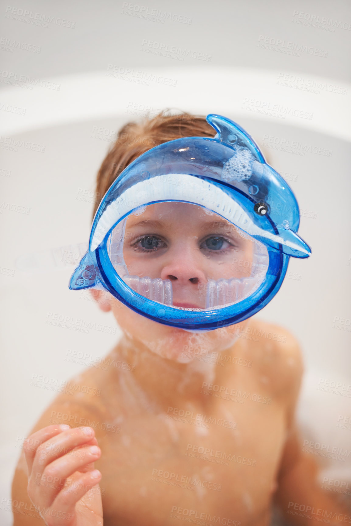 Buy stock photo Portrait of a cute young boy wearing dolphin goggles in the bath