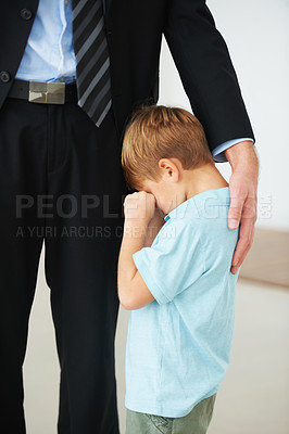 Buy stock photo Man, work and support for child with sad, crying and autism by businessman to stop fear, anxiety and care. Father, kid or mental health in house to help, tired or professional papa with hand of love