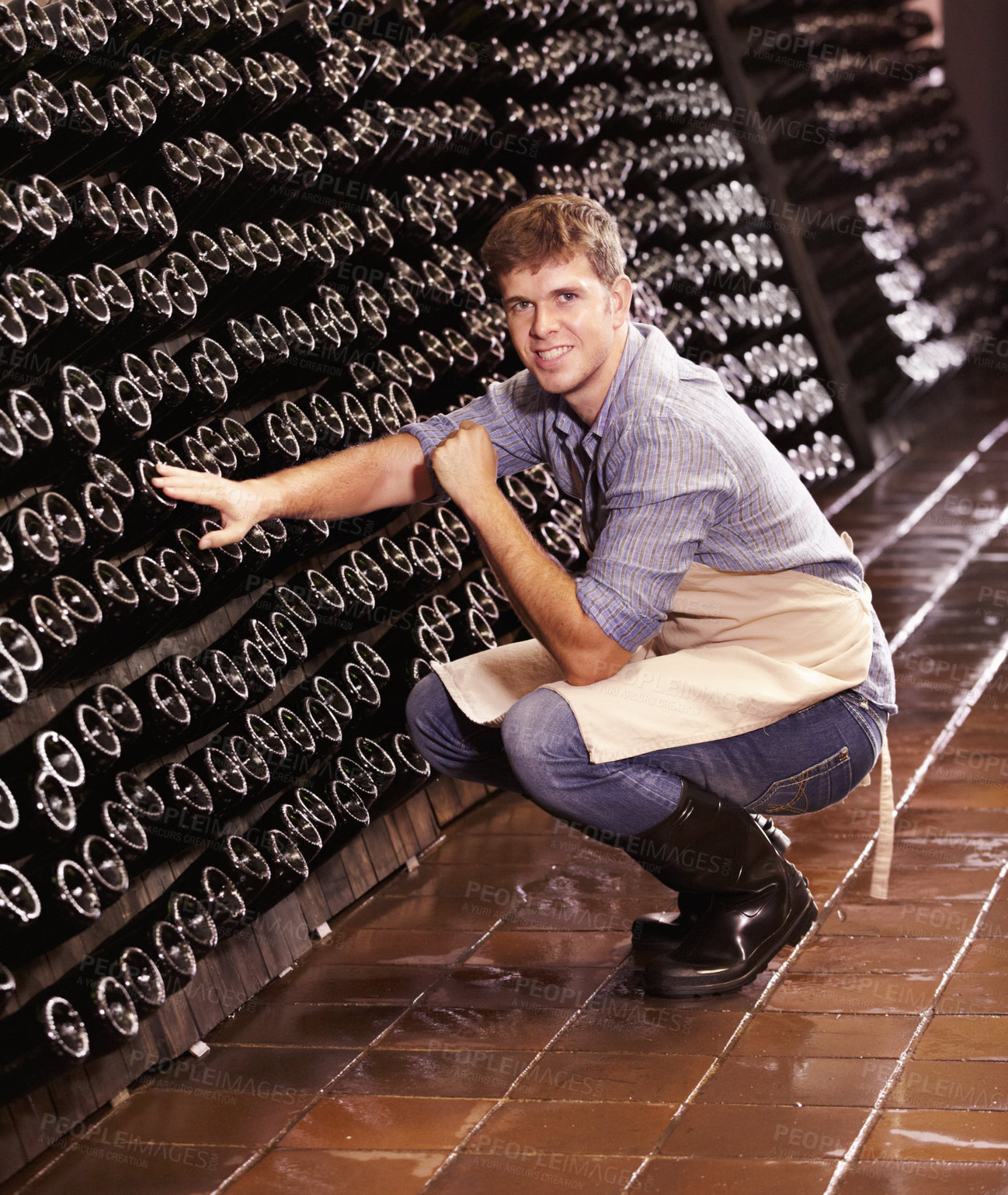 Buy stock photo Portrait, man and counting bottles of wine in cellar, warehouse or factory. Alcohol, manufacturing and male person count, happy inspection or quality control at production plant, winery or distillery