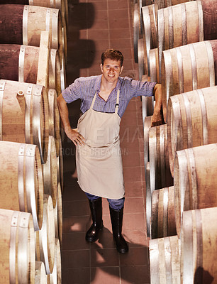 Buy stock photo Man, wine and cellar portrait smile at work in alcohol industry as an employee at warehouse. Winery, expert and storage plant as a worker for job as profession in catering drink for happiness. 