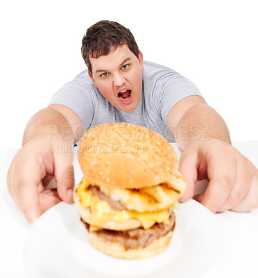 Buy stock photo Plus size, portrait of man holding burger and unhealthy diet, isolated hungry person and white background. Junk food, weight loss and healthcare problem, cholesterol or fat food addiction in studio.
