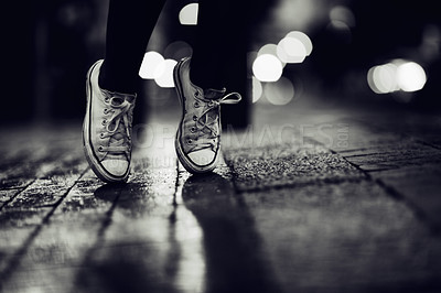 Buy stock photo Cropped image of a person wearing sneakers standing on their toes in the street