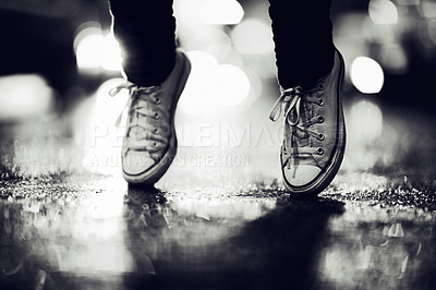 Buy stock photo Cropped image of a person wearing sneakers standing on their toes in the street