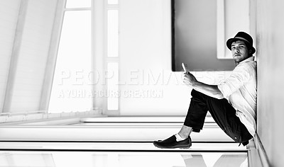 Buy stock photo A formally dressed man appears to be sitting on a window while leaning against the floor - perspective