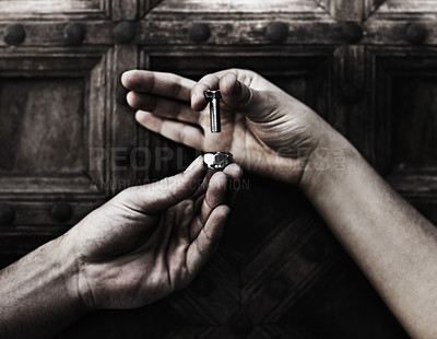 Buy stock photo Closeup of two hands holding a nut and bolt against a wooden door