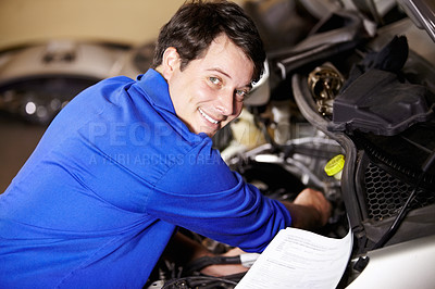 Buy stock photo Portrait, happy man and mechanic with document on engine of car, repair or maintenance. Smile, face and technician with paperwork on motor vehicle, auto service or workshop, garage or small business
