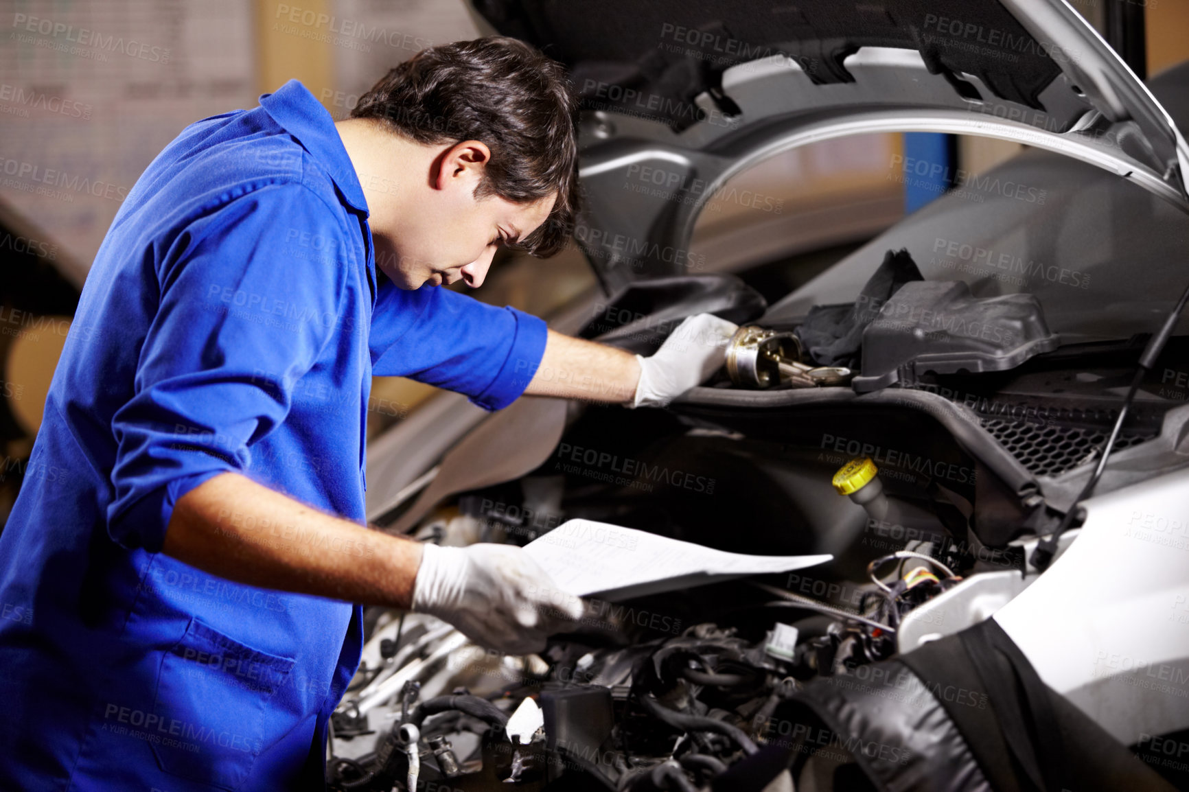 Buy stock photo Document, man and technician check engine of car, repair and maintenance. Checklist, mechanic and serious person on motor vehicle hood, inspection list or fixing transportation at auto service garage