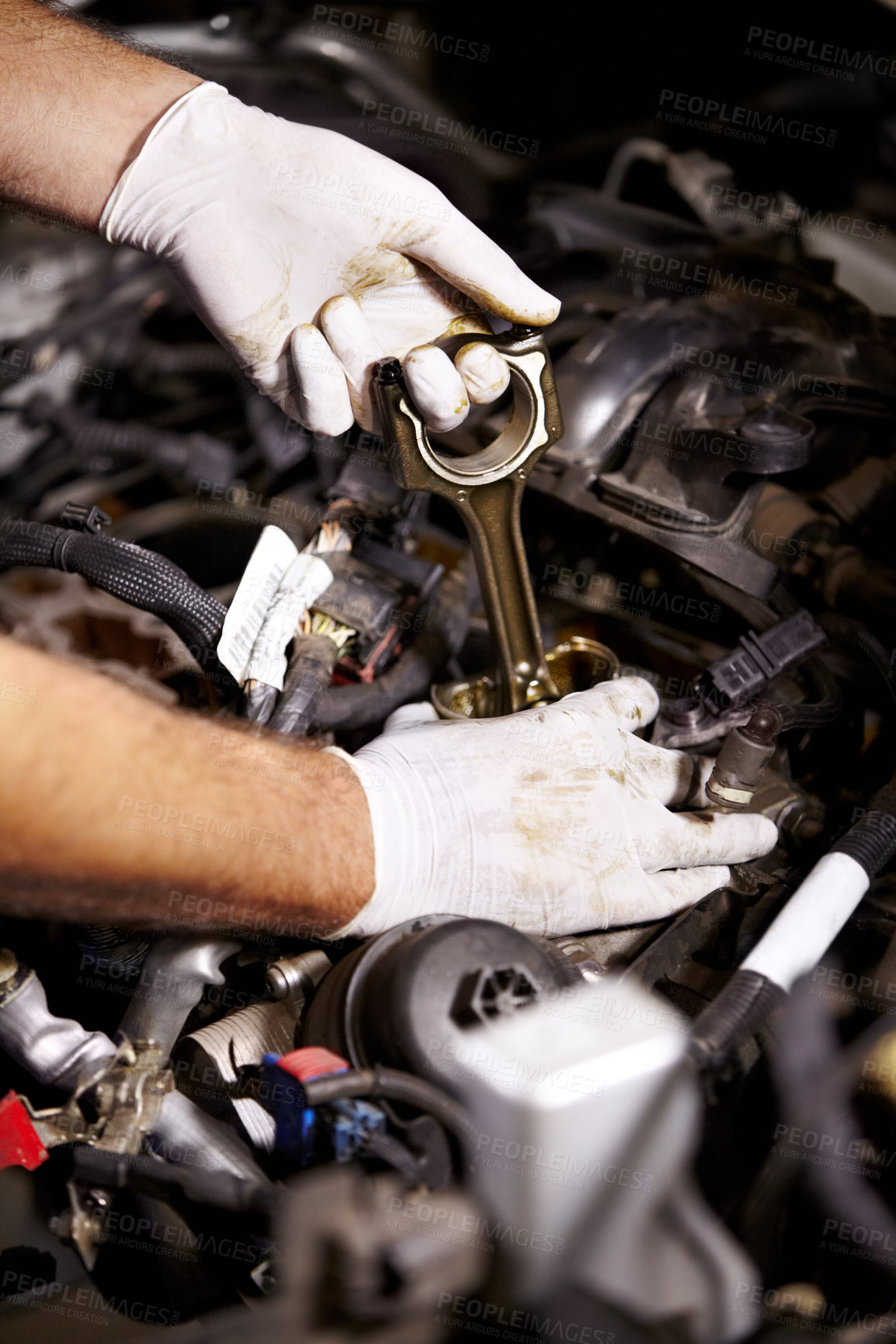 Buy stock photo Cropped image of a male mechanic's hands about to check the oil of a car