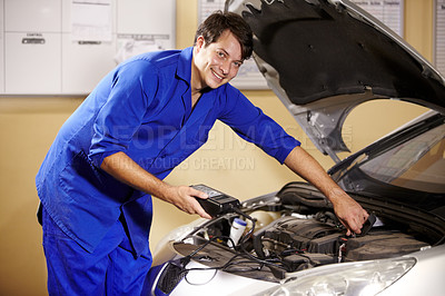 Buy stock photo Smile, portrait and a mechanic with a car for maintenance, battery repair or work on an engine. Happy, workshop and a man, or prerson building a vehicle or transport in a garage for motor inspection