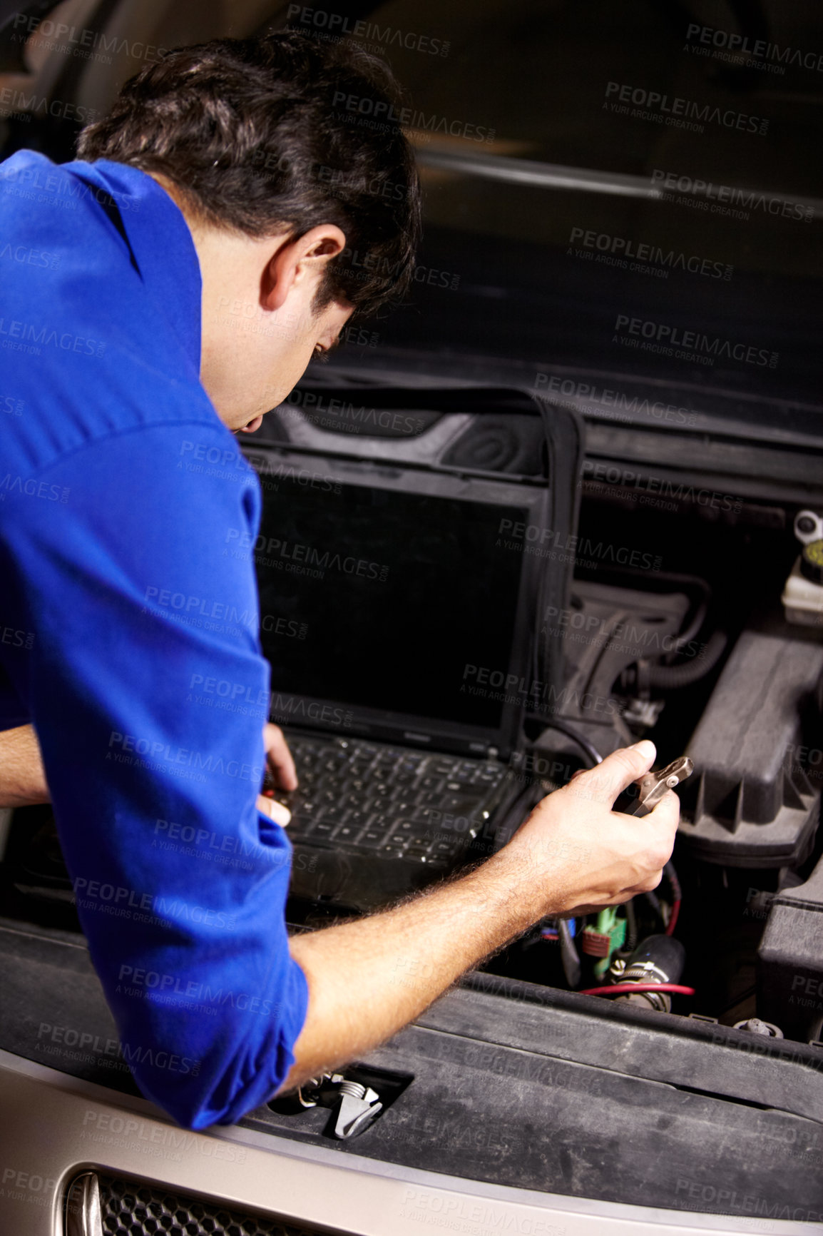 Buy stock photo Car, diagnostic or repair and a mechanic man in a workshop as an engineer looking at the engine of a vehicle. Garage, report or service with a young technician working under the hood of an automobile