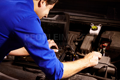 Buy stock photo Hands, car or repair and a mechanic man in a workshop as an engineer looking at the engine of a vehicle. Garage, service or maintenance with a young technician working under the hood of an automobile