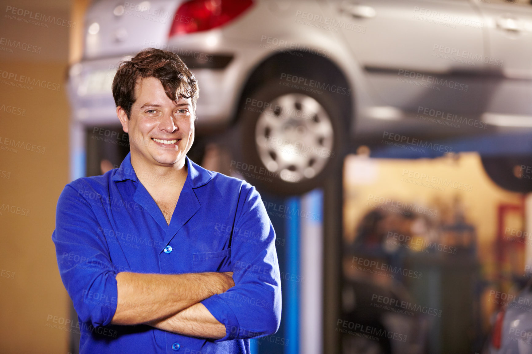 Buy stock photo Happy, portrait and a mechanic with arms crossed in a workshop for pride in a car. Smile, working and a man in a garage for work, maintenance or building a vehicle for transportation or inspection