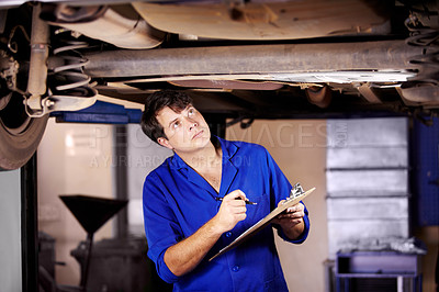 Buy stock photo Car, inspection or service with a mechanic man in a garage for a report on a vehicle repair for insurance. Maintenance, professional and expertise with a young engineer in a workshop for assessment