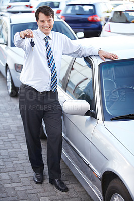 Buy stock photo Businessman, portrait and key in hand to car with sale of auto, transportation and investment. Vehicle, dealership or man with keys in parking lot from salesman for test drive, opportunity or driving