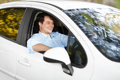 Buy stock photo Smile, road trip and a man driving a car outdoor for travel, freedom or adventure in an autumn forest. Journey, ride or commute with a happy young person in a vehicle form transport as a driver