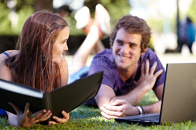 Buy stock photo Students, outdoor and laptop on grass, university and smile for workbook, learning and technology. College, notebook and teenager for education, career or studying together for exam, man and woman