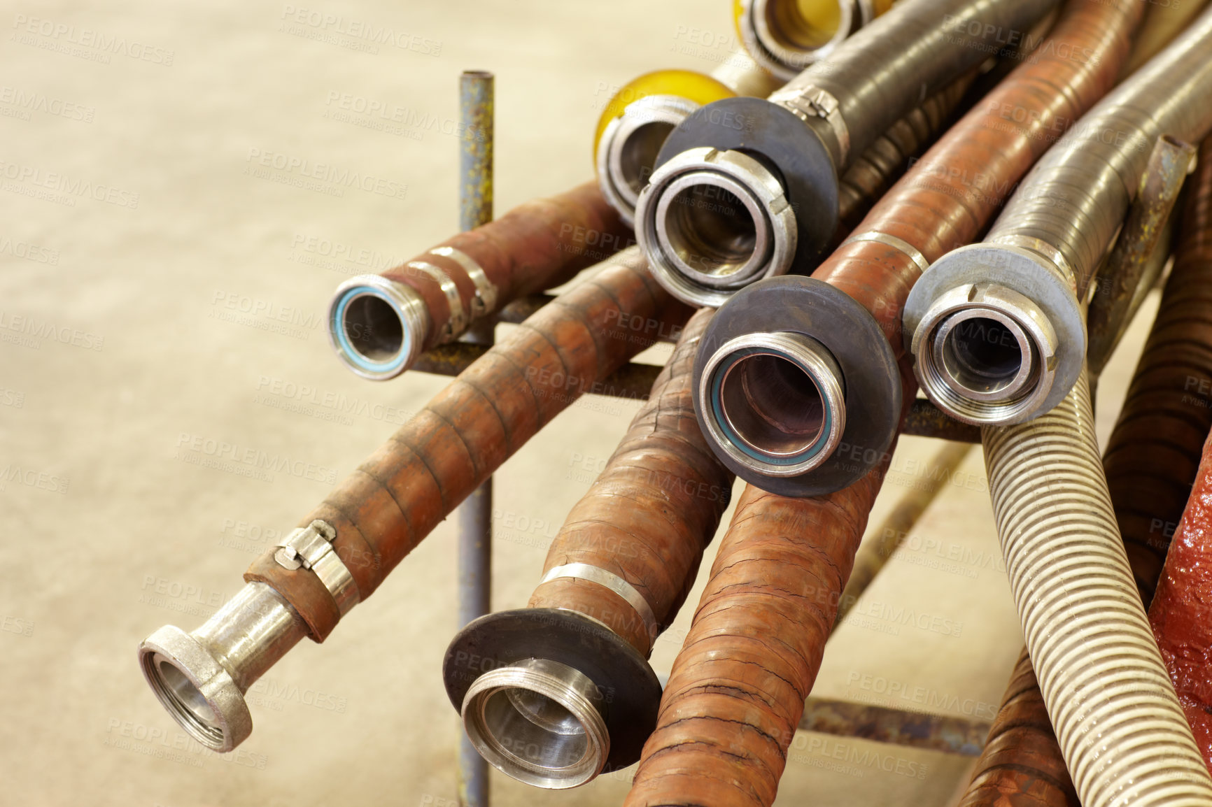 Buy stock photo Shot of unused hoses in a wine factory 