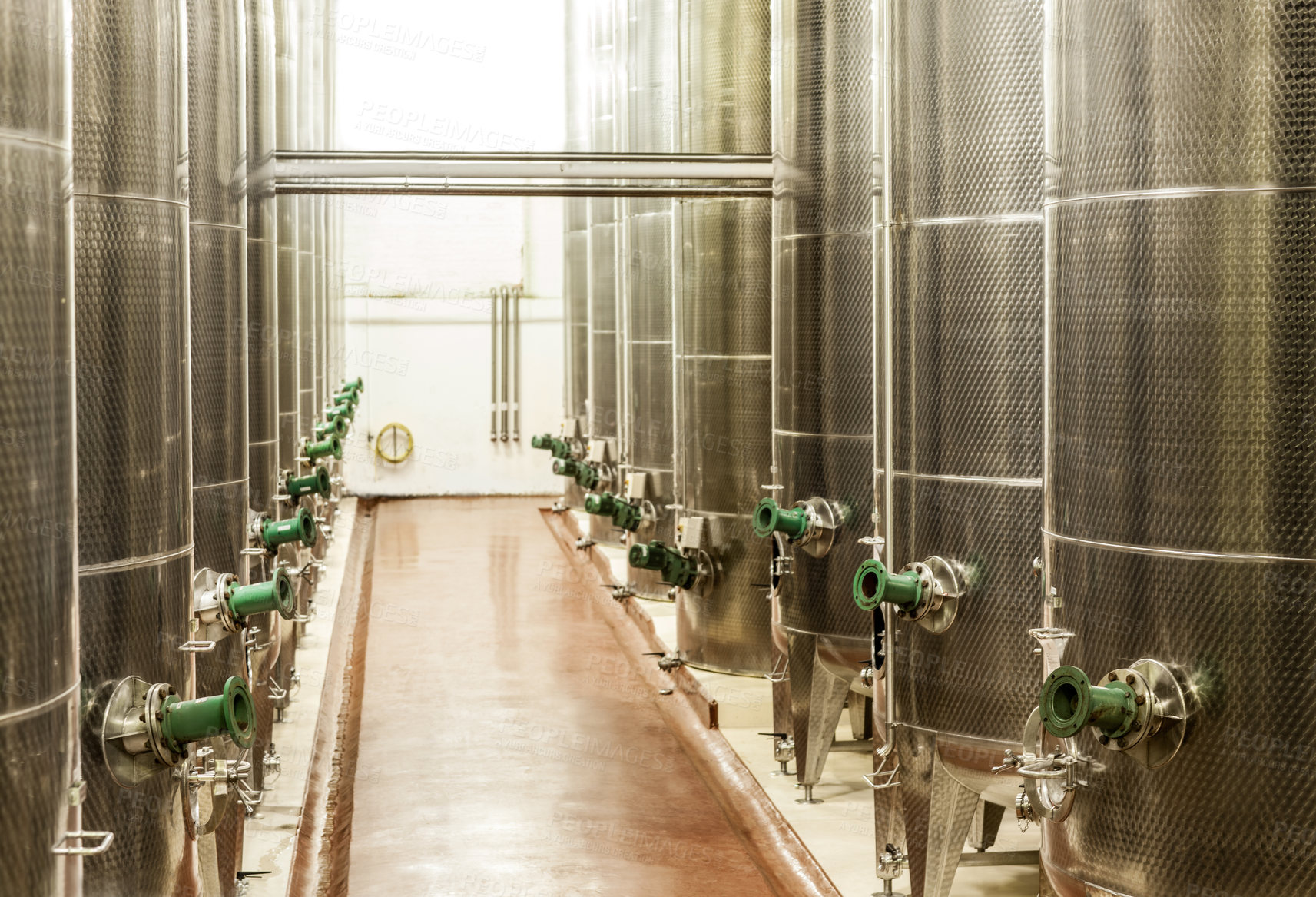 Buy stock photo Shot of the fermentation vessels inside a winemaking factory