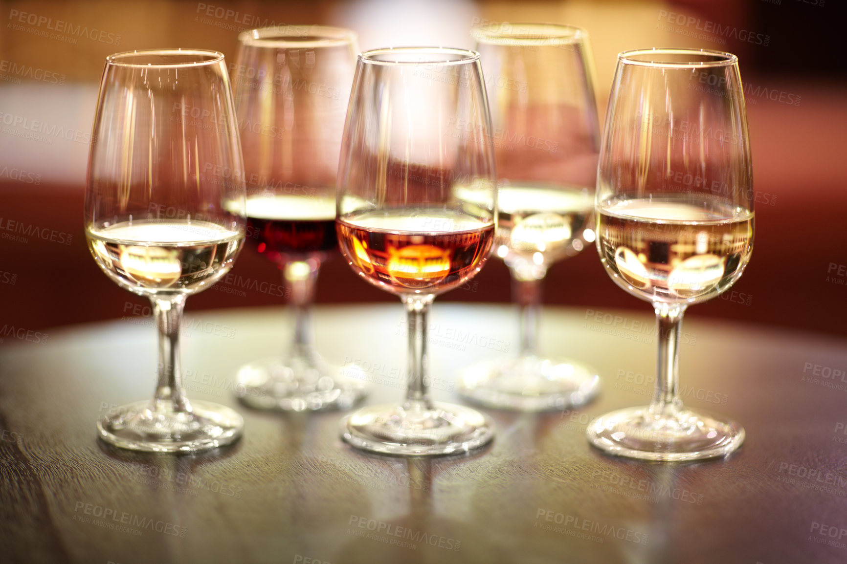 Buy stock photo Shot of five glasses of different wines on a table