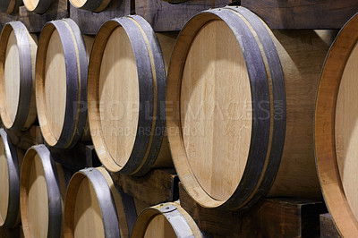 Buy stock photo Background, wine cellar and barrel in brewery for beer production, alcohol manufacturing or whiskey fermentation. Closeup, wood cask container or liquor storage in winery, factory or distillery vault