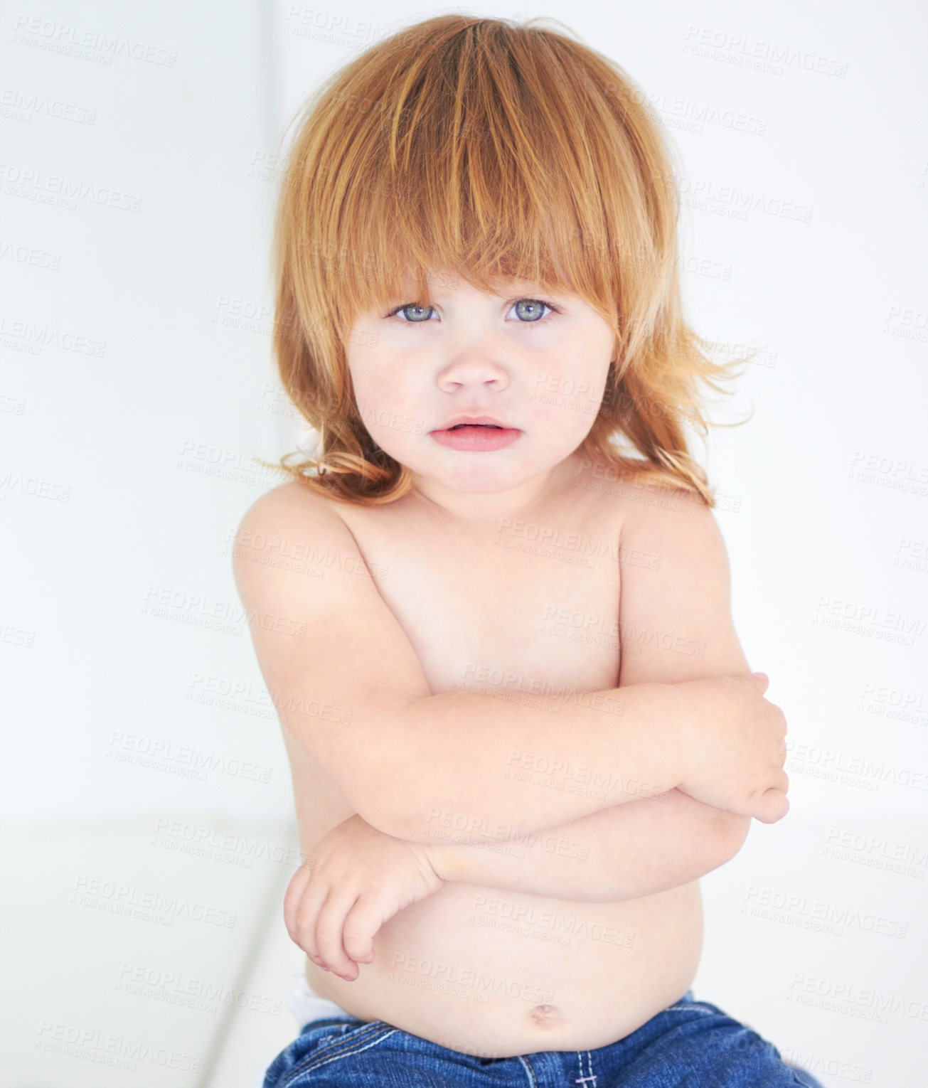 Buy stock photo A cute baby looking miserable with her arms folded