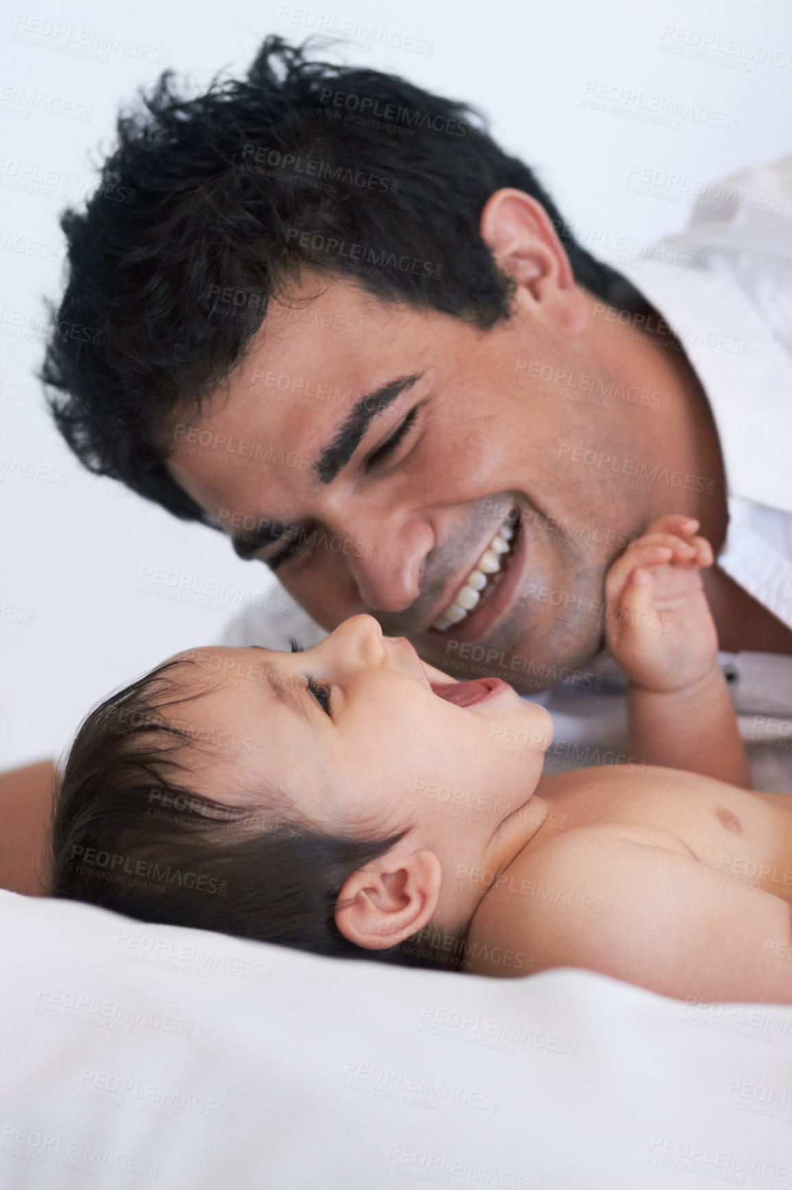Buy stock photo Baby, laugh and dad on a bedroom bed with happiness, bonding and parent care with smile. Father, happy and young child together in a home playing and kid laughing from papa love and youth support