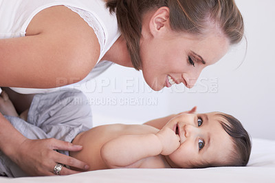 Buy stock photo Mother, happy and baby smile at home on diaper changing table with happiness. Family, house and young child with mom feeling love, care and parent support from bonding together with cute kid and mama