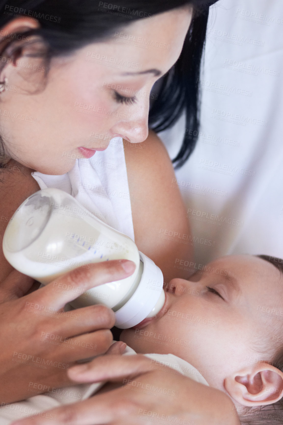 Buy stock photo Baby, feeding and mom with child at home with a bottle of milk with parent care with kids. Family, young youth and drink for growth and development with a mother feeling proud from childcare in house