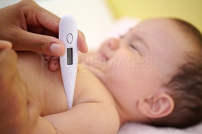 Buy stock photo A cute baby girl laughing as her mother is taking her temperature under her arm