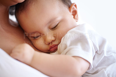 Buy stock photo Closeup of a baby girl sleeping in her mother's arms