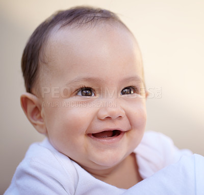 Buy stock photo Happy, closeup face of a baby with a smile and health wellness for childhood development. Happiness or excited, childhood or giggle for fun and toddler smiling for healthcare with laugh for comedy