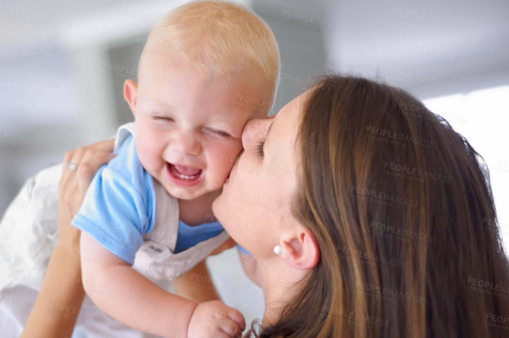 Buy stock photo Young beautiful mother holding her cute baby