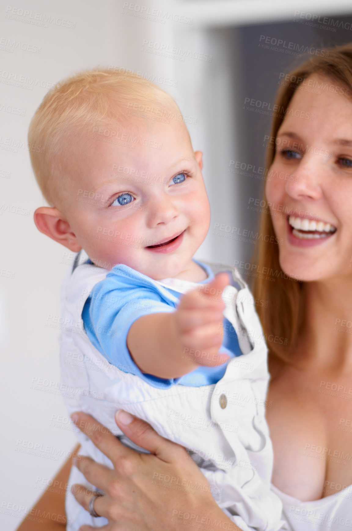 Buy stock photo Happiness, love and curious baby with woman, growth and development in early childhood and family with care. Young mother, toddler and smile, parenting and bonding with motherhood and cute kid