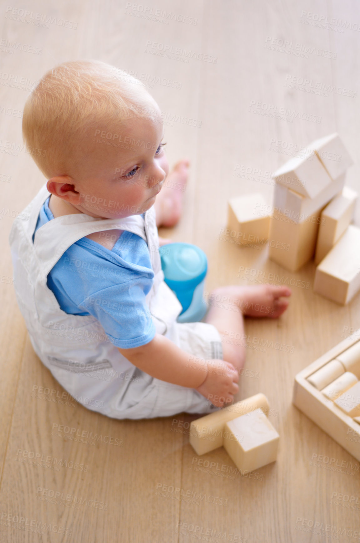 Buy stock photo Little baby boy, toys and wooden blocks on floor for playtime, learning or childhood development at home. Cute, adorable or growing infant of newborn, child or toddler playing on the ground in house