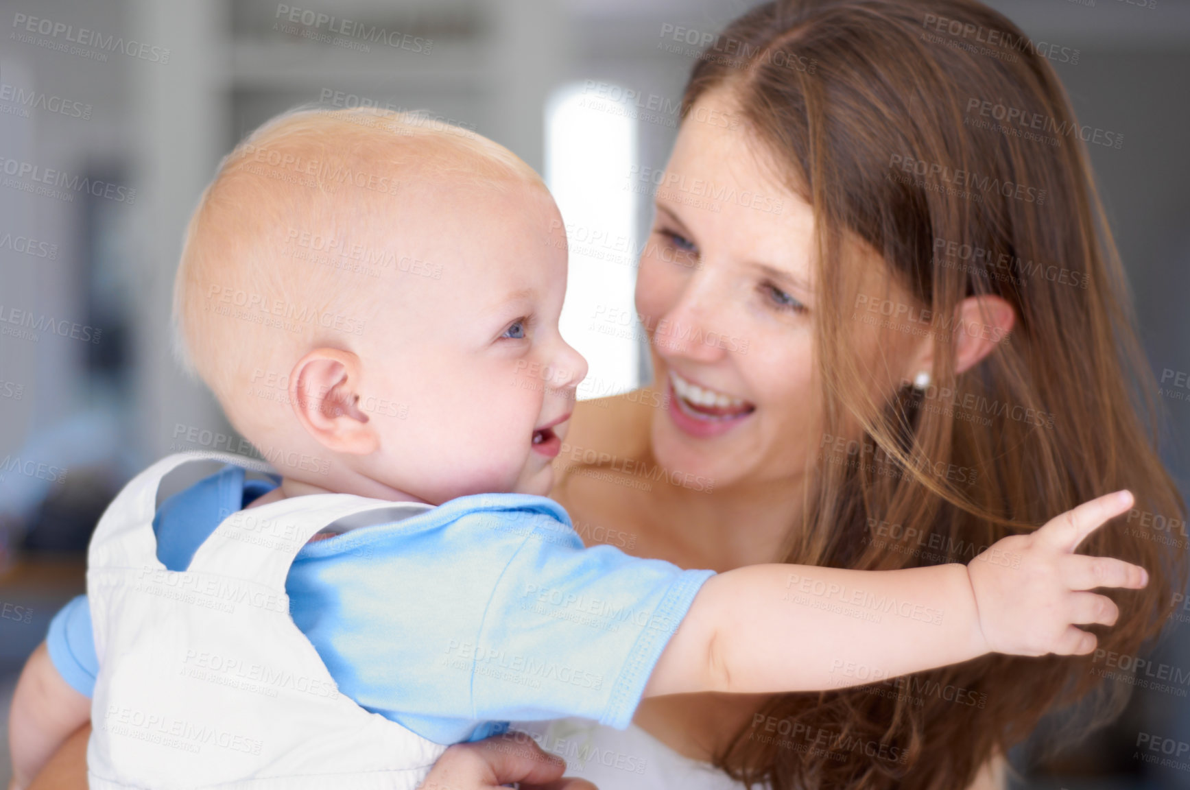 Buy stock photo Young beautiful mother holding her cute baby
