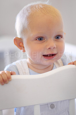 Buy stock photo Happy, children and baby in the crib of a nursery in his home for growth, child development or curiosity. Kids, bedroom and toddler with a male or boy infant standing in his cot looking adorable