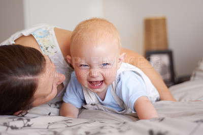 Buy stock photo Happy, playing and a baby with mother on a bed for bonding, laughing and fun together. Smile, love and a family, child or mom in the bedroom for care, funny and playful in a house with a joke