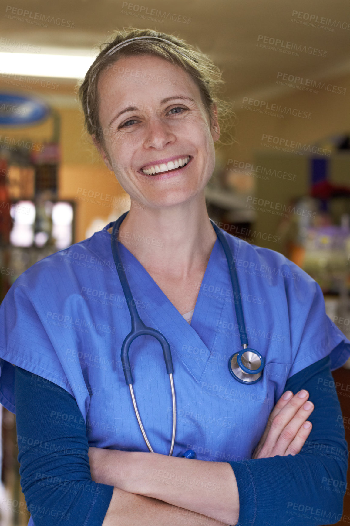 Buy stock photo Portrait of a happy veterinarian standing with her arms folded